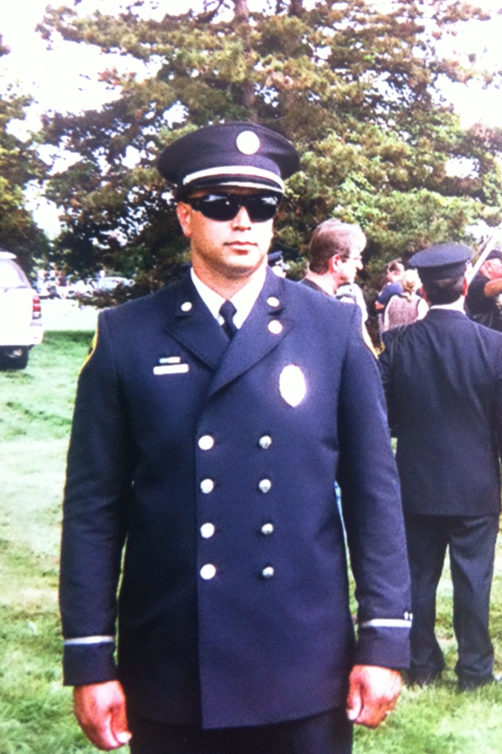 Hector Martinez in Pontiac Fire Department dress uniform at a ceremony